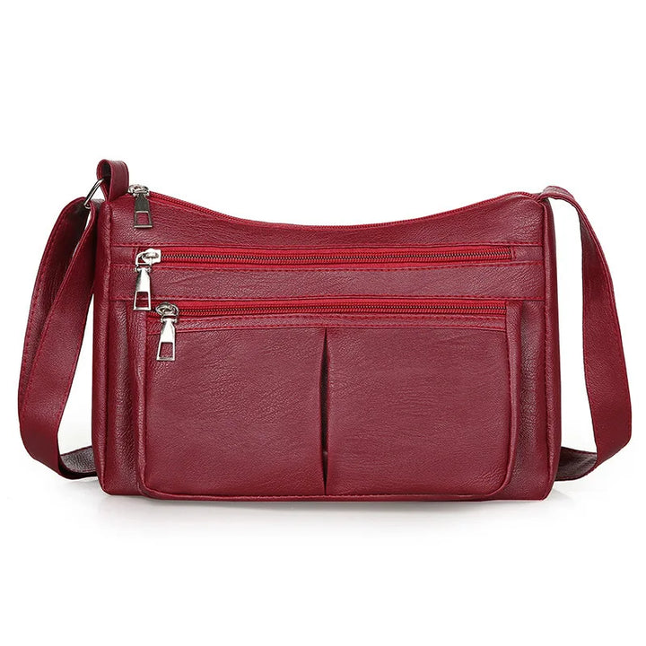 Kožená crossbody kabelka s viacerými vreckami