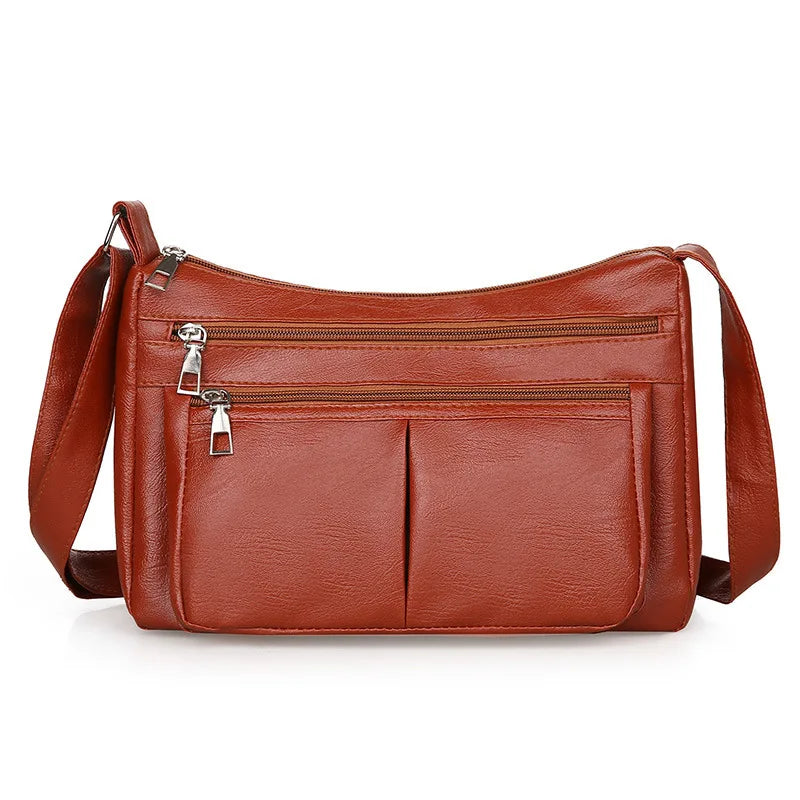 Kožená crossbody kabelka s viacerými vreckami