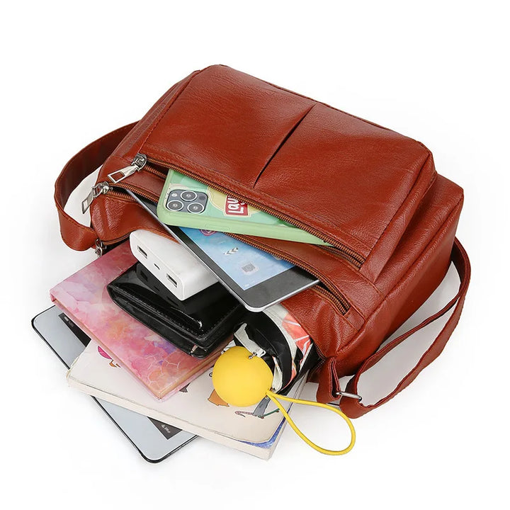 Kožená crossbody kabelka s viacerými vreckami