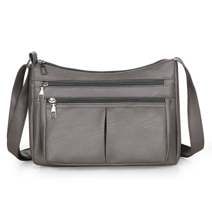 Kožená crossbody kabelka s viacerými vreckami